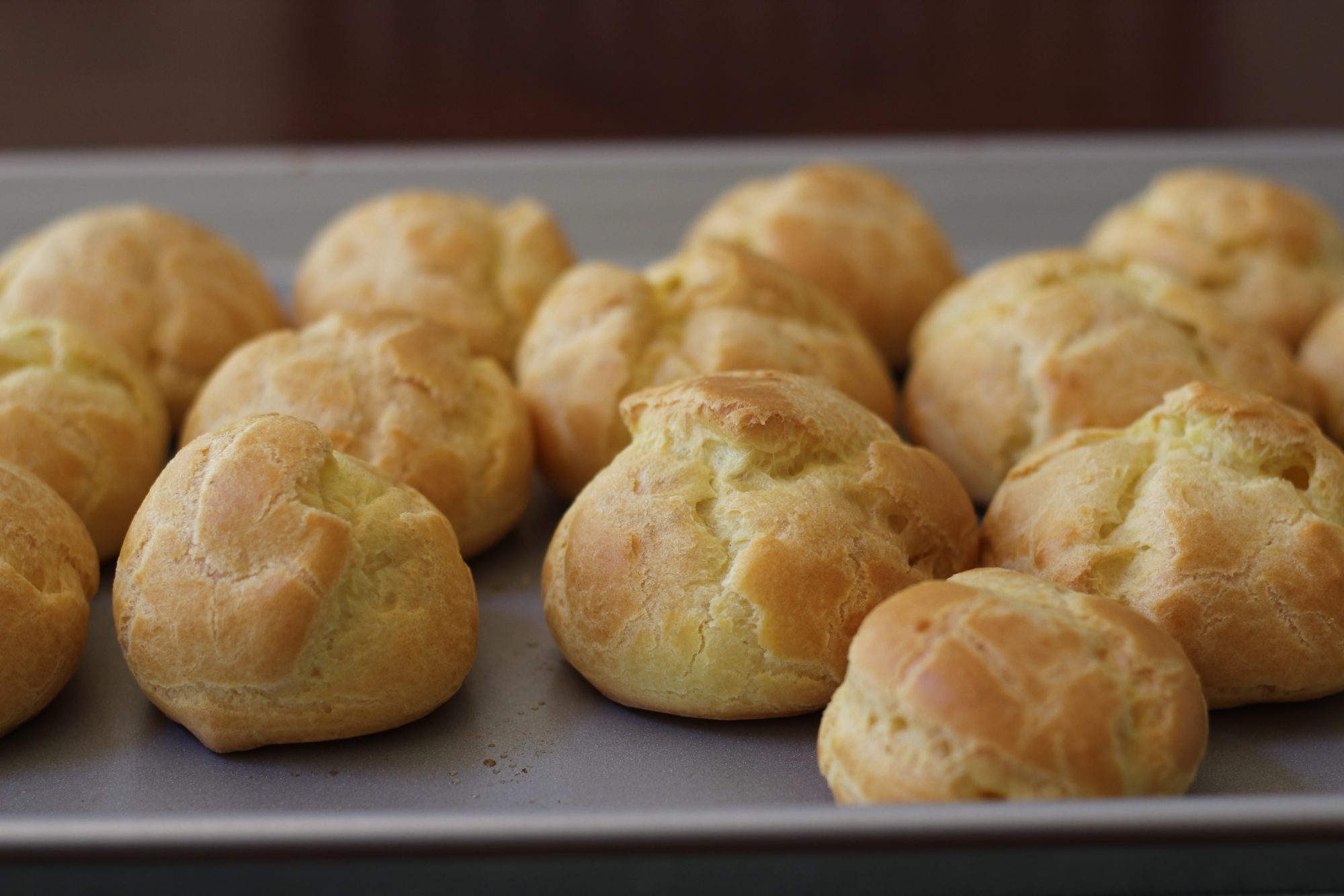 The puff balls should be crisp on the outside when baked.