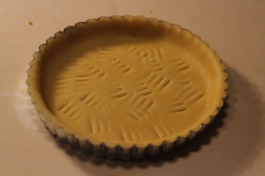 Prick pastry bottom with fork